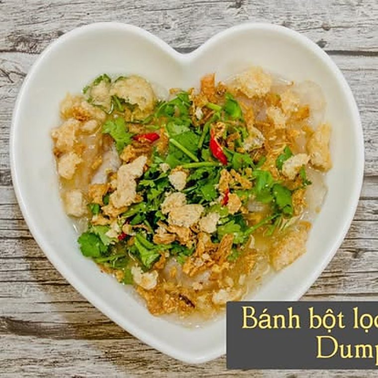 Banh bot loc tapioca dumplings topped with herbs and crispy shallots