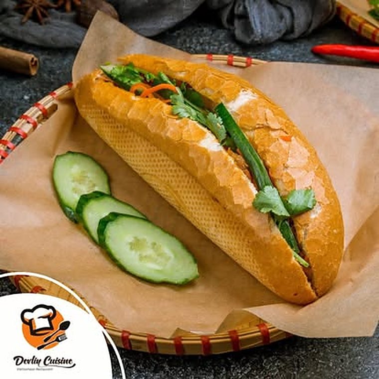 Banh mi with cucumber on a woven tray