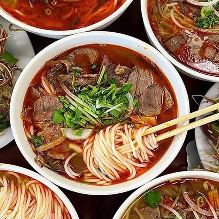 Bun bo Hue, spicy red beef noodle soup with herbs