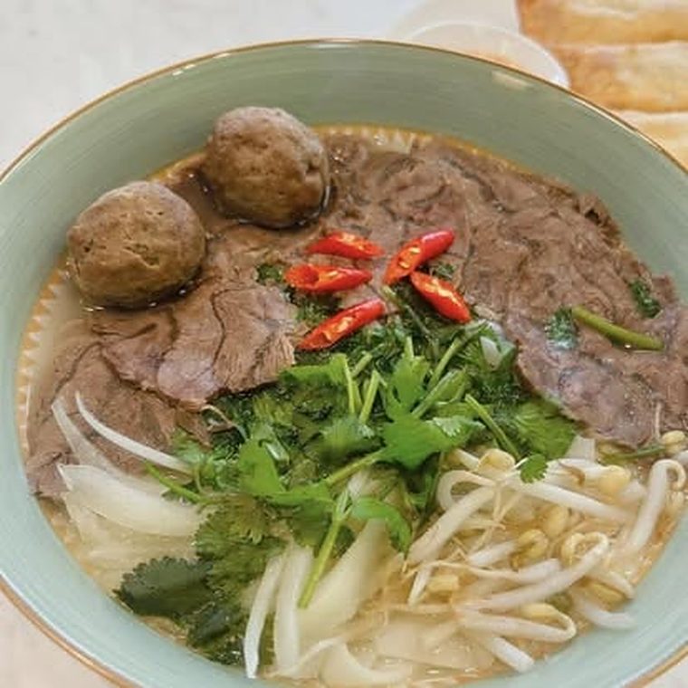 Beef and beef ball pho with chili, onion and cilantro